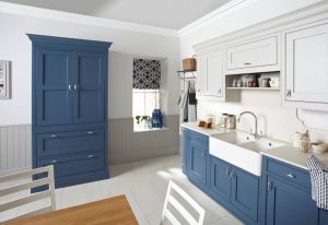 Kitchen with white and blue drawers, cupboards