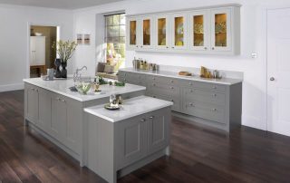 Neutral coloured kitchen with bench and cupboards