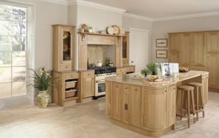 Wooden kitchen cupboards with marble bench-top