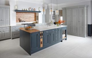 Modern kitchen with bench with build in drawers, large pantry and wooden splashback
